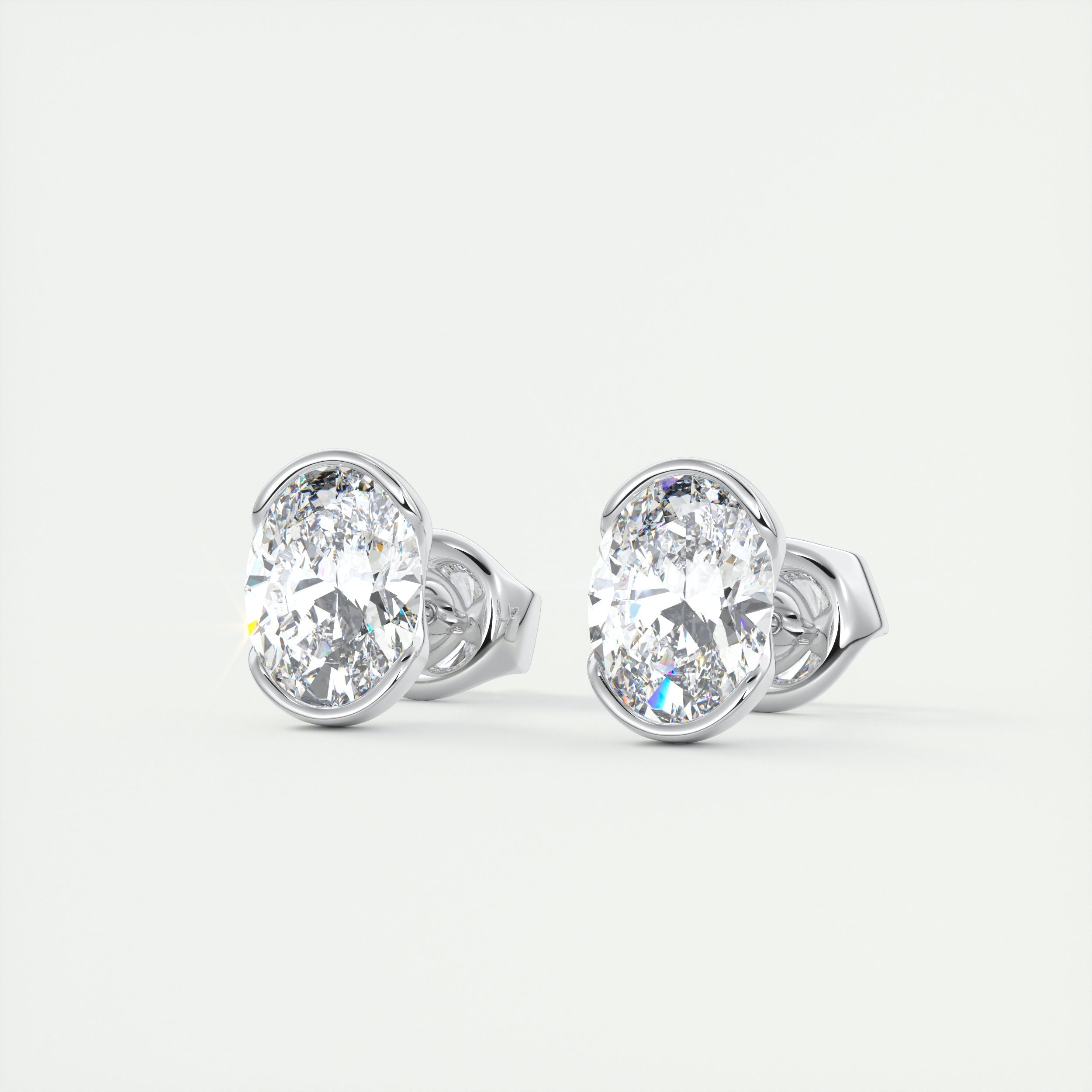 1.0CT Oval Half Bezel Solitaire D-VVS Lab Grown Diamond Earrings