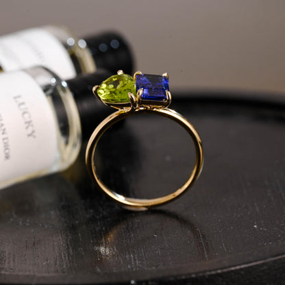 Solid Gold Toi et Moi Emerald Cut Lab Grown Sapphire & Pear Peridot Engagement Ring
