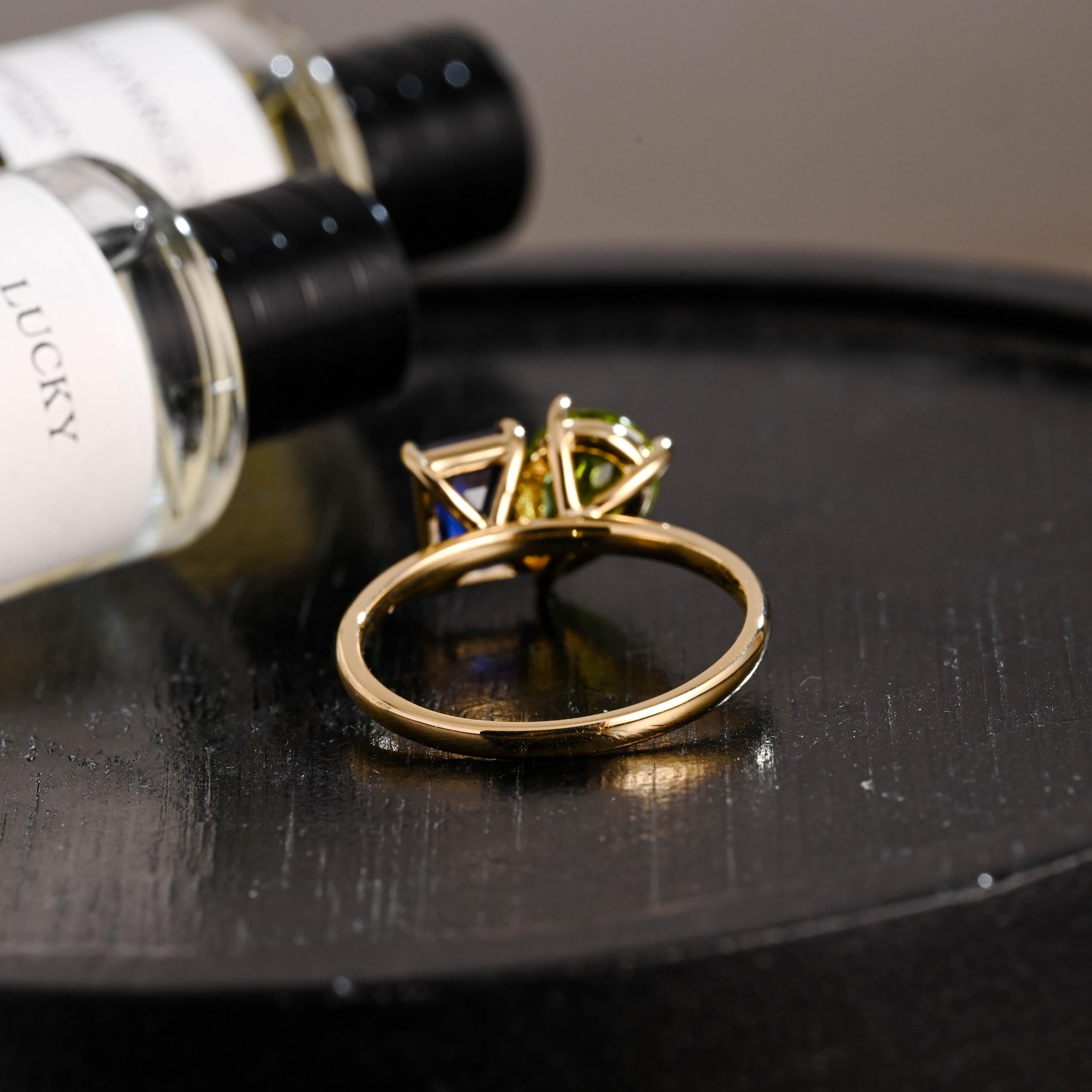 Solid Gold Toi et Moi Emerald Cut Lab Grown Sapphire & Pear Peridot Engagement Ring
