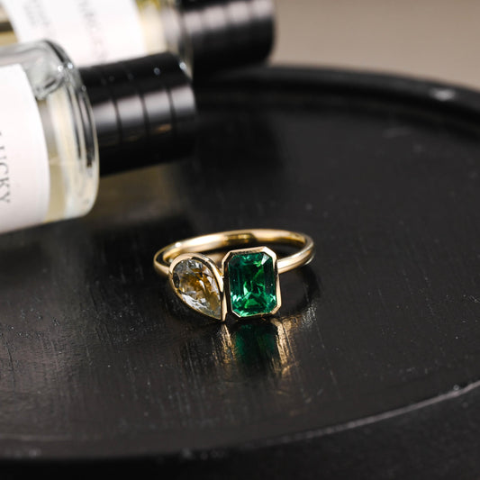 Solid Gold Toi et Moi Lab Grown Emerald & Pear Santa Maria Color Sapphire Engagement Ring